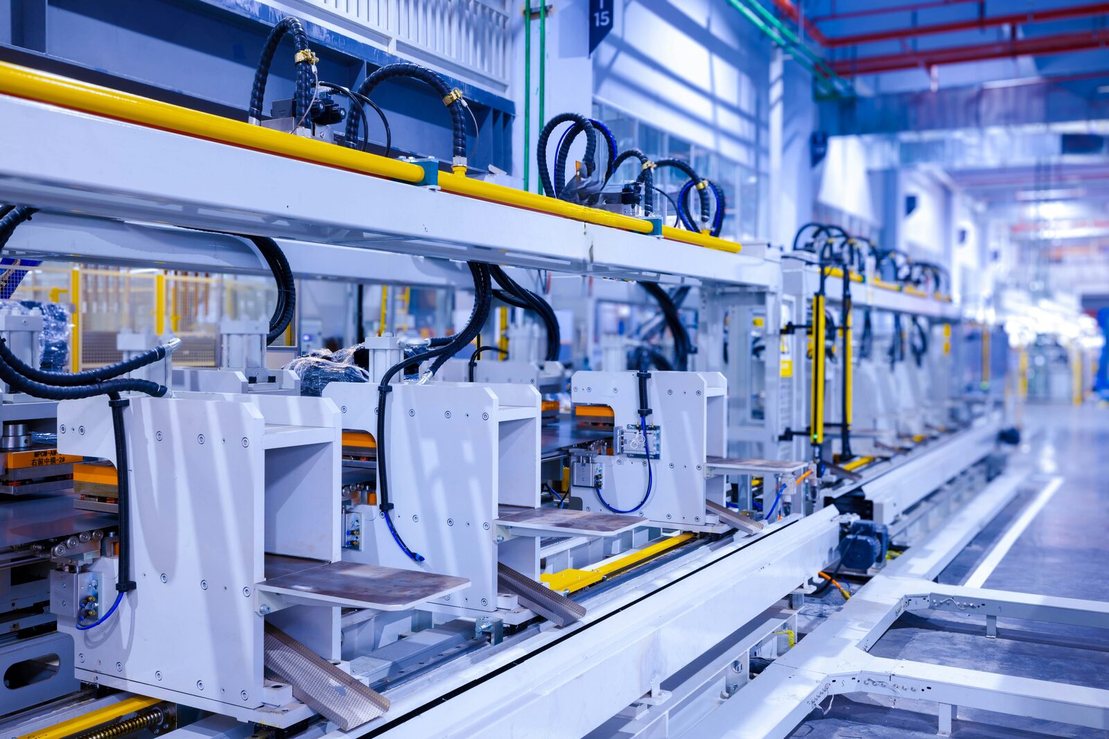 Automated industrial production line in a modern factory hall